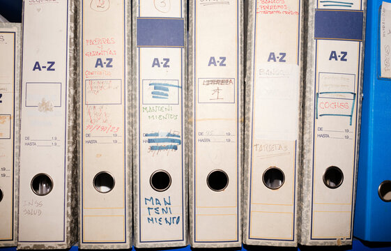 Receipt archive folders in blue shelf
