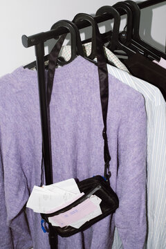 A handbag overflowing with receipts