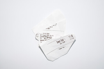 A crumpled receipt on a white background