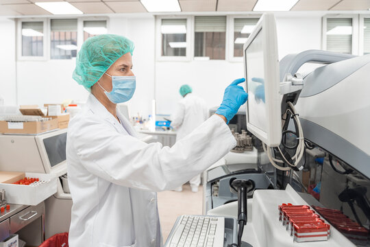 scientist touching screen of machine
