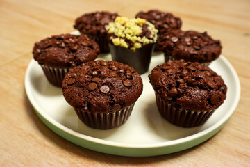 Chocolate muffin or cupcake with chocochips topping