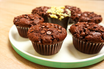 Chocolate muffin or cupcake with chocochips topping