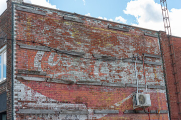 Fototapeta premium ghost sign of what was once a Coca-Cola mural in Toronto, Canada