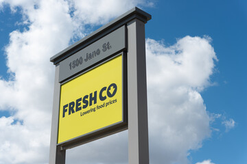 Fototapeta premium exterior pylon sign of Freshco Jane & Denison, a grocery store chain, located at 1500 Jane Street in Toronto, Canada