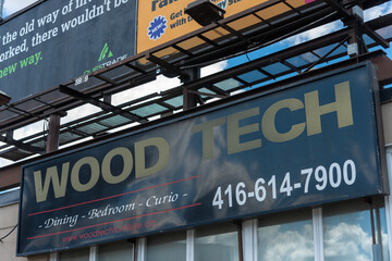 Fototapeta premium roadside billboard for Wood Tech, a furniture store, located at 1300 Jane Street in Toronto, Canada