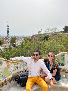 A couple portrait sitting in a bench of the Park G&uuml;ell in Spain