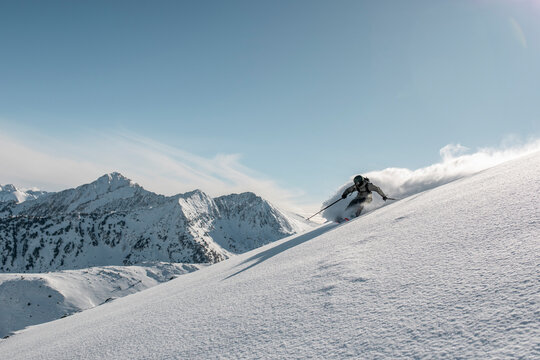 Fast skier going downhill