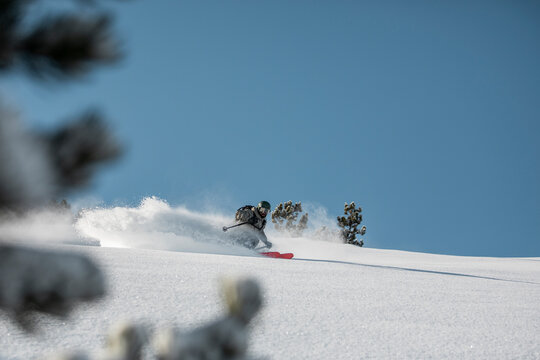 Fast skier going downhill