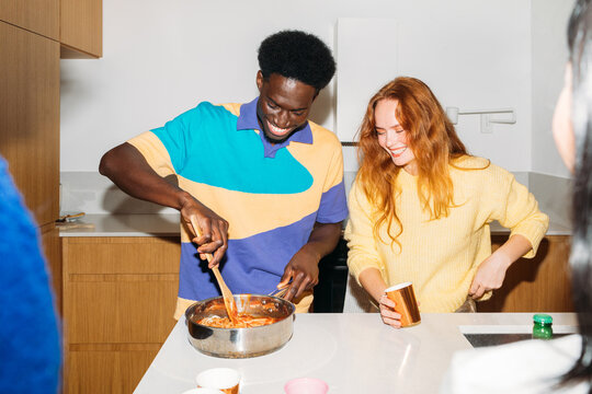 Friends making dinner