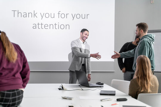 Successful Presentation. Listeners Congratulating The Speaker.