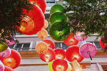 Colorful Lanterns Adorning the Urban Sky