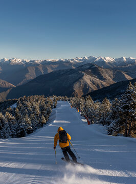 Man doing ski touring at sunrise