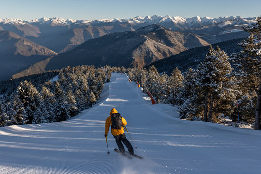 Man doing ski touring at sunrise