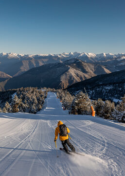 Man doing ski touring at sunrise
