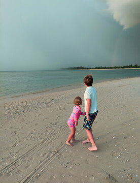 sibling looking at  waterfront storm ,  ugc