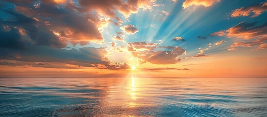 Sun Shining Through Clouds Over Ocean