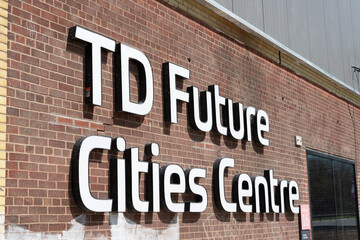 Fototapeta premium exterior wall and sign of TD Future Cities Centre, an exhibition and trade centre, located at 550 Bayview Avenue in Toronto, Canada (Evergreen Brick Works)