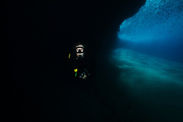 Active woman scuba diver enjoying peace and quiet