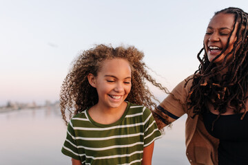 Happy mother and daughter at the beach