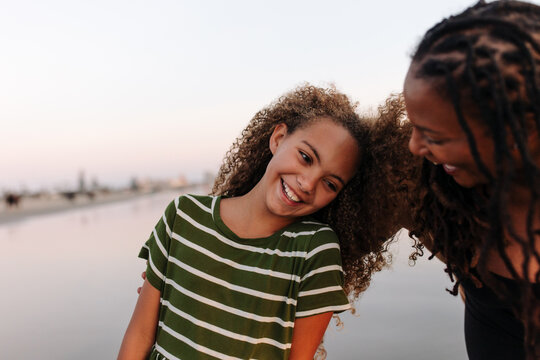 Happy mother and daughter at the beach