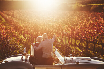 Romantic, senior couple and vintage car by countryside for wine tasting, sharing drink or memories...