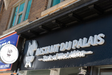 Fototapeta premium exterior building facade and sign of Instant du palais, a restaurant, located at 557 Mount Pleasant Road in Toronto, Canada