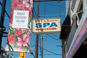 Fototapeta premium Mount Pleasant Village hanging banner and sign for a SPA (Health Recovery Center) located at 617 Mount Pleasant Road in Toronto, Canada