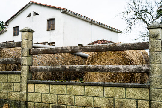 Rustic farmhouse with hay bales in Asturias, Spain