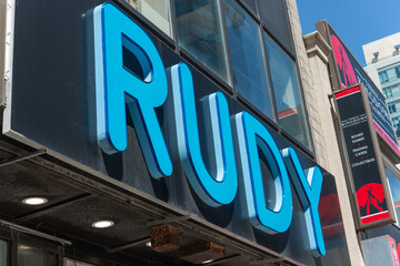 Fototapeta premium exterior building and sign of RUDY, a restaurant, located at 168 Eglinton Avenue East in Toronto, Canada