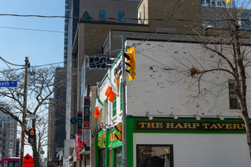 Fototapeta premium exterior signage at The Harp Tavern located at 180 Eglinton Avenue East in Toronto, Canada