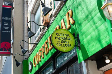 Fototapeta premium exterior building facade and round sign outside the COFFEE BAR - Turkish Espresso & Irish Coffees located at 174 Eglinton Avenue East in Toronto, Canada