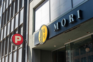 Obraz premium exterior building facade and sign of MORI, a modern izakaya restaurant, located at 30 Eglinton Avenue East in Toronto, Canada