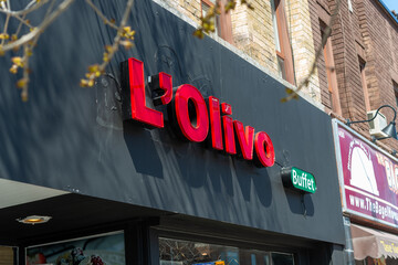 Fototapeta premium exterior building and sign of L’ Olivo, a buffet restaurant, located at 454 Eglinton Avenue West in Toronto, Canada