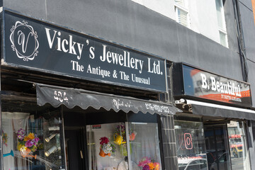 Fototapeta premium exterior building and sign of Vicky's Jewellery Ltd located at 404 Eglinton Avenue West in Toronto, Canada (B. Beautiful is next door)