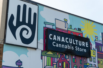 Fototapeta premium exterior building wall mural and sign of CanaCulture Cannabis Store located at 914 Eglinton Avenue West in Toronto, Canada