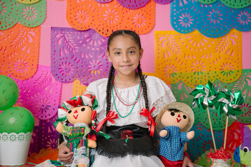 Smiling Girl with Traditional Mexican Dolls and Festive Decor