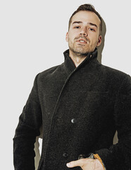 A guy in a black coat , portrait on white