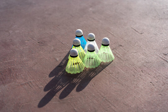 Shuttlecocks Lined Up In Sunlight.