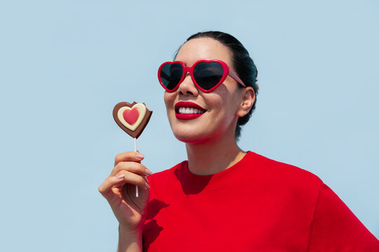 Smiling Woman with Heart-Shaped Chocolate