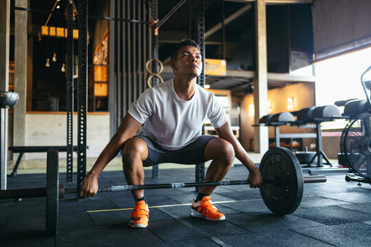 Man lifting weights at the gym