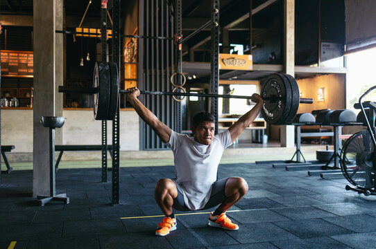 Man lifting heavy weights at the gym