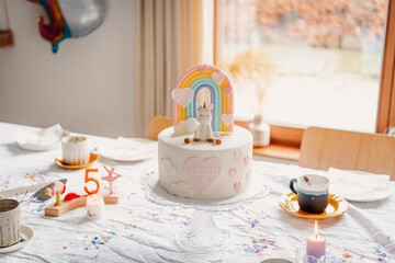 Unicorn and Rainbow themed birthday cake and table