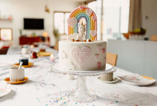 Unicorn and Rainbow themed birthday cake and table