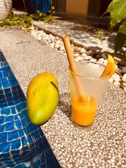 mango smoothie by the pool in Cambodia - travel texture in Cambodia