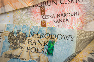 Czech and polish National Bank on banknotes close-up economic relations concept
