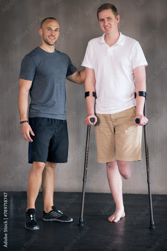 Canvas Prints Physiotherapy, crutches and man with disability in portrait for walking, muscle strength and coach for support. Amputee, exercise and physiotherapist for physical therapy in healthcare centre