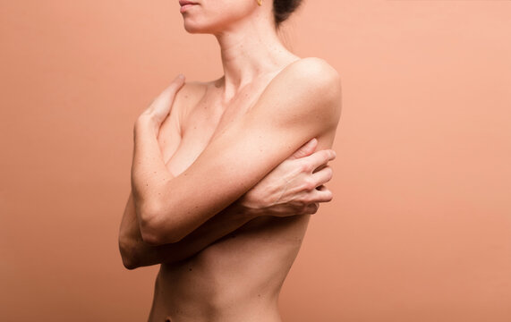 Beauty of female body with crossed arms