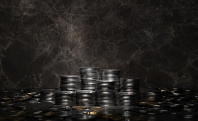 stacks with metal coins on a dark background