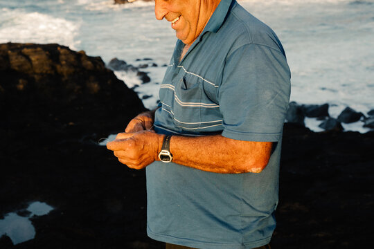 Close-up of a fisherman preparing his bait