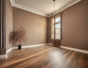 empty room with hardwood flooring, stained in a rich brown shade. The walls are painted in a soft...